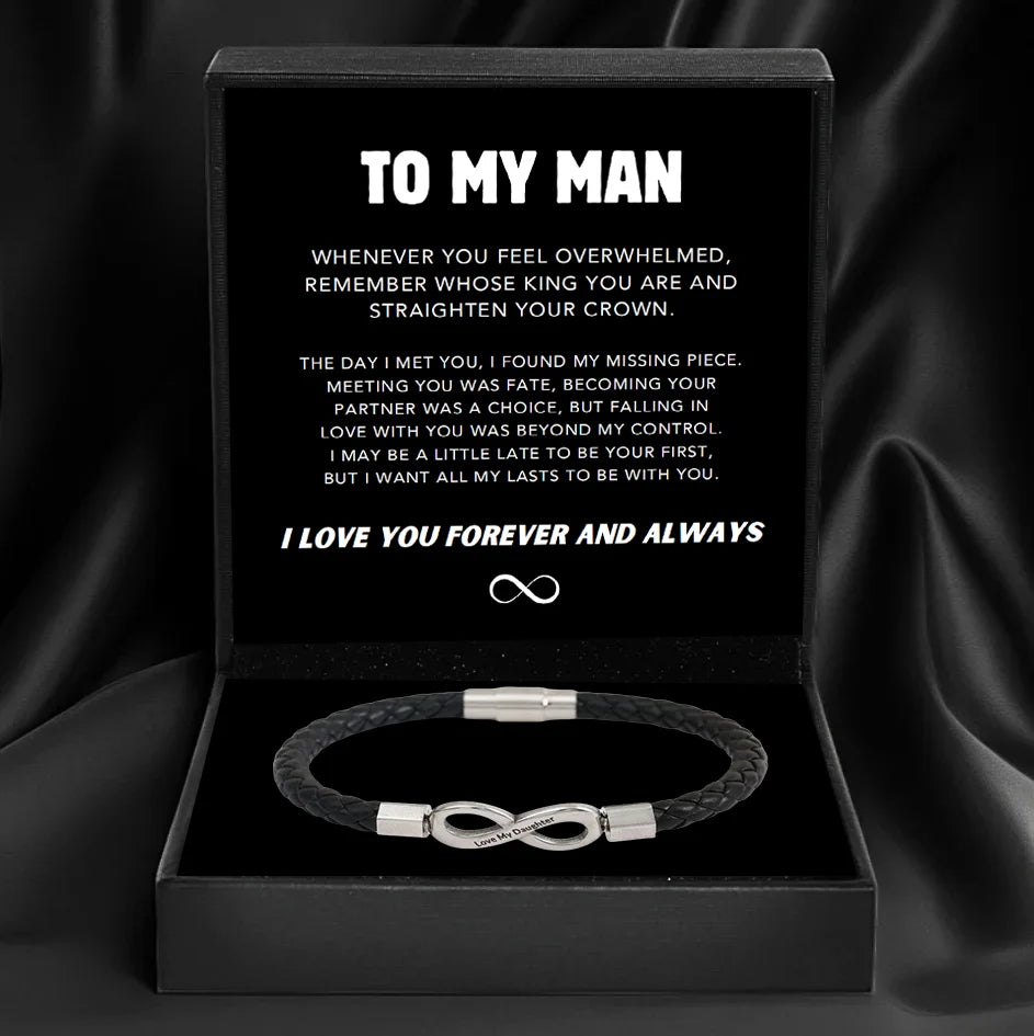 Black box with a bracelet and a sentimental message for a man on a dark background
