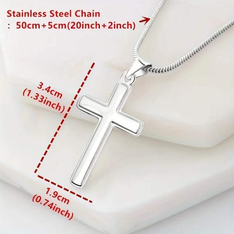 Silver cross pendant necklace with measurements on a white background