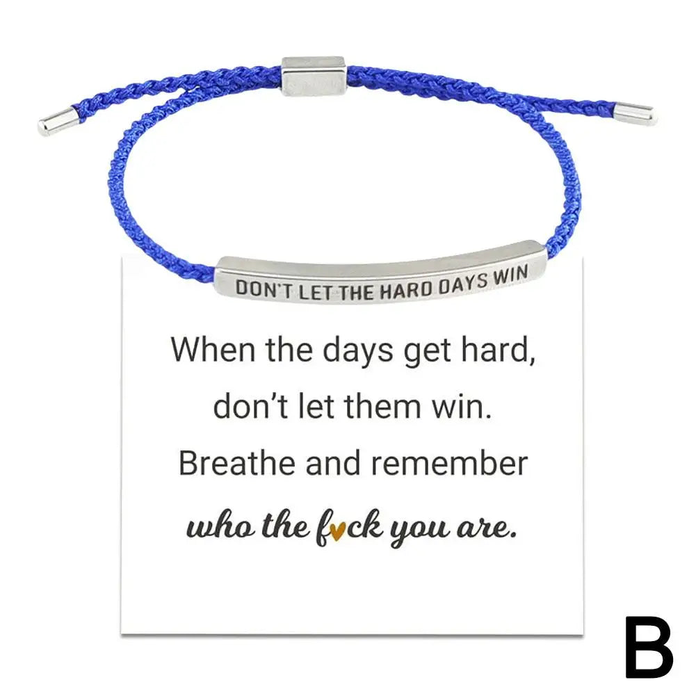 Blue braided bracelet with motivational message on a white background