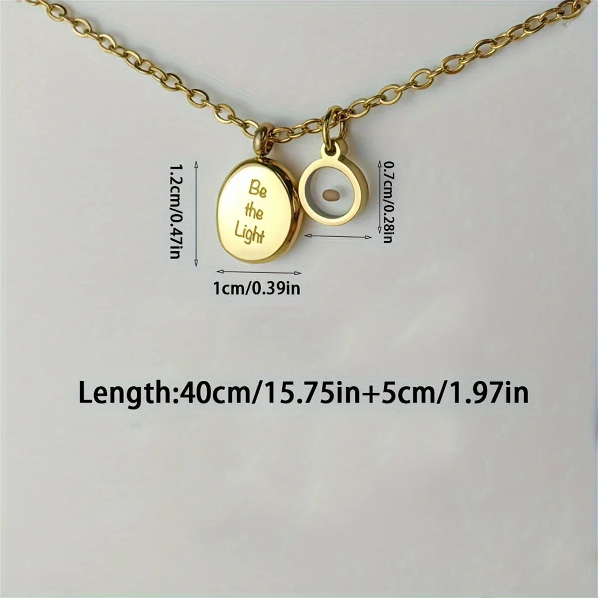 Gold necklace with pendant and measurement details on a light gray background