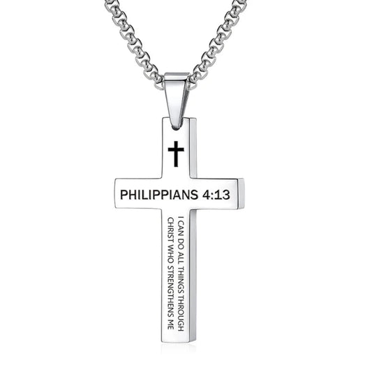 Silver cross necklace with 'Philippians 4:13' engraving on a white background