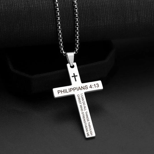 Silver cross pendant with 'Philippians 4:13' text on a black background