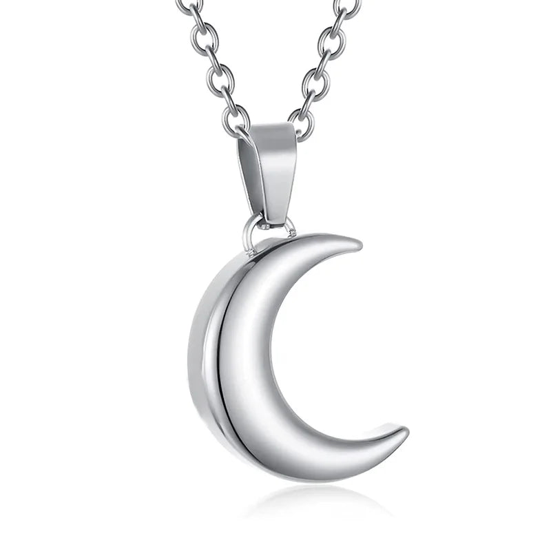 Silver crescent moon necklace on a white background