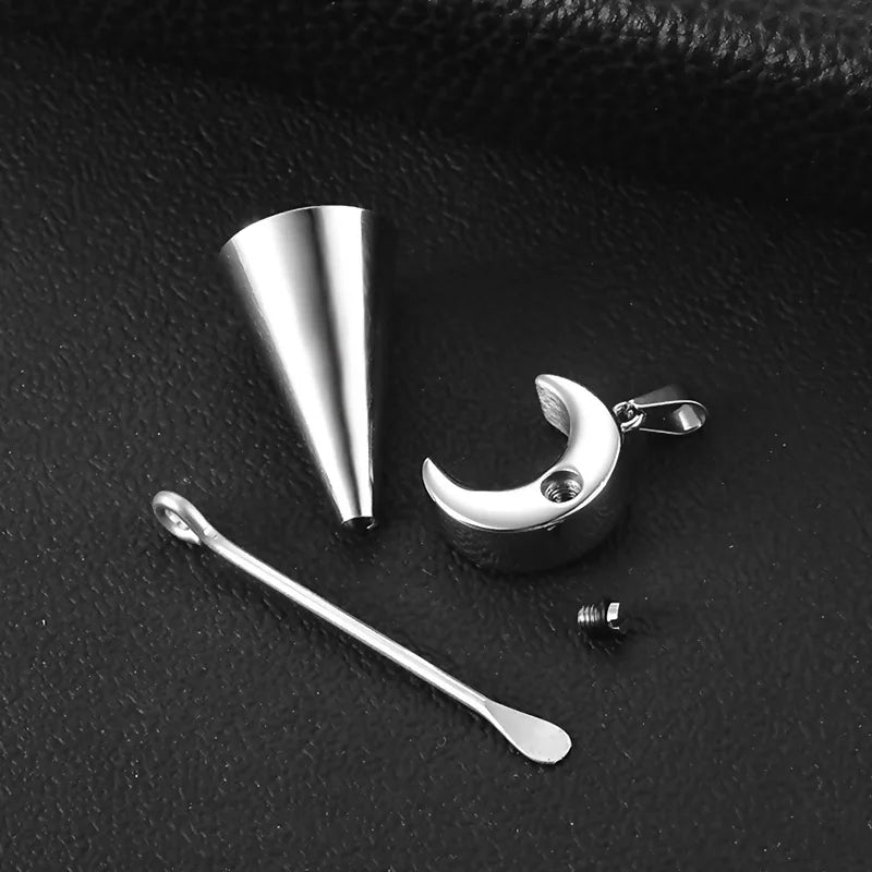 Set of silver jewelry components on a dark textured surface