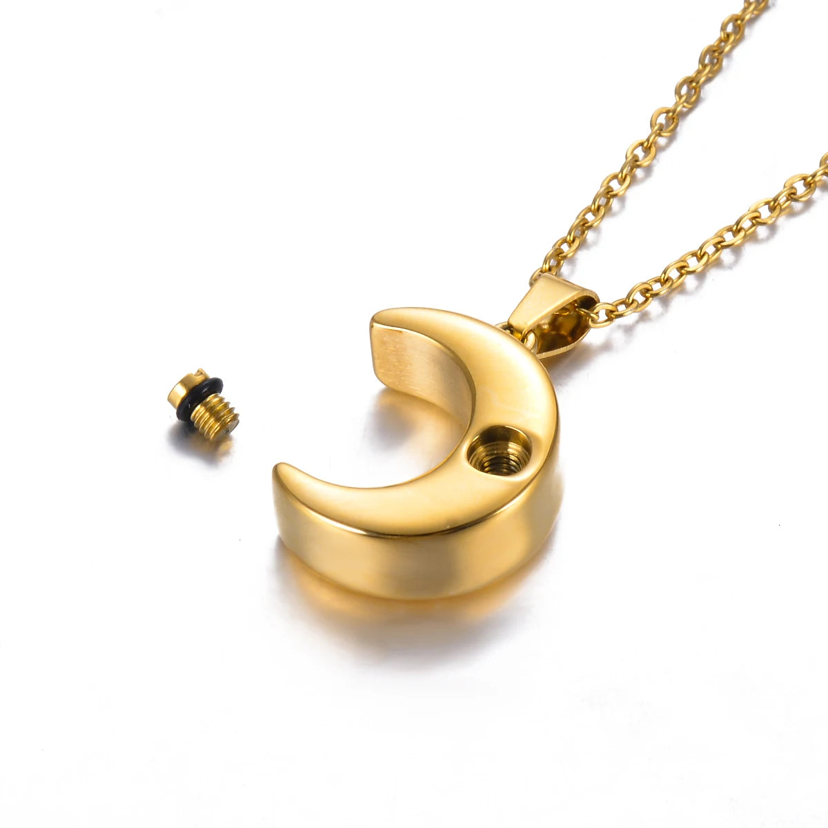 Gold crescent moon necklace on a white background