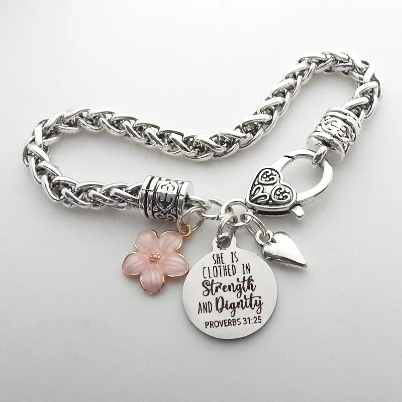 Silver bracelet with floral and heart charms on a light gray background