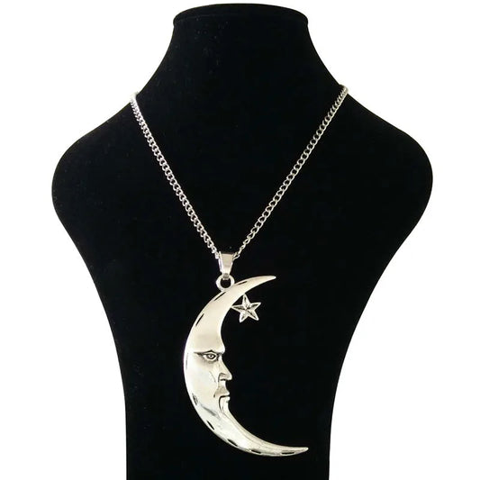 Silver necklace with a crescent moon and star pendant on a black mannequin bust.
