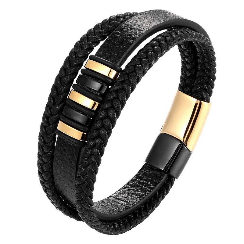Black braided leather bracelet with gold and black metal accents on a white background