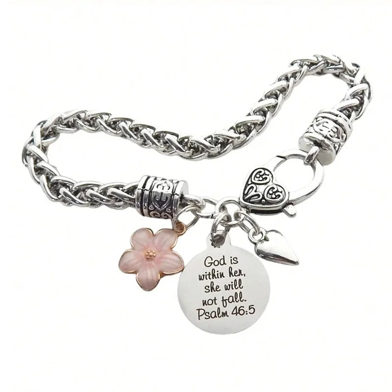 Silver bracelet with floral and heart charm on a white background