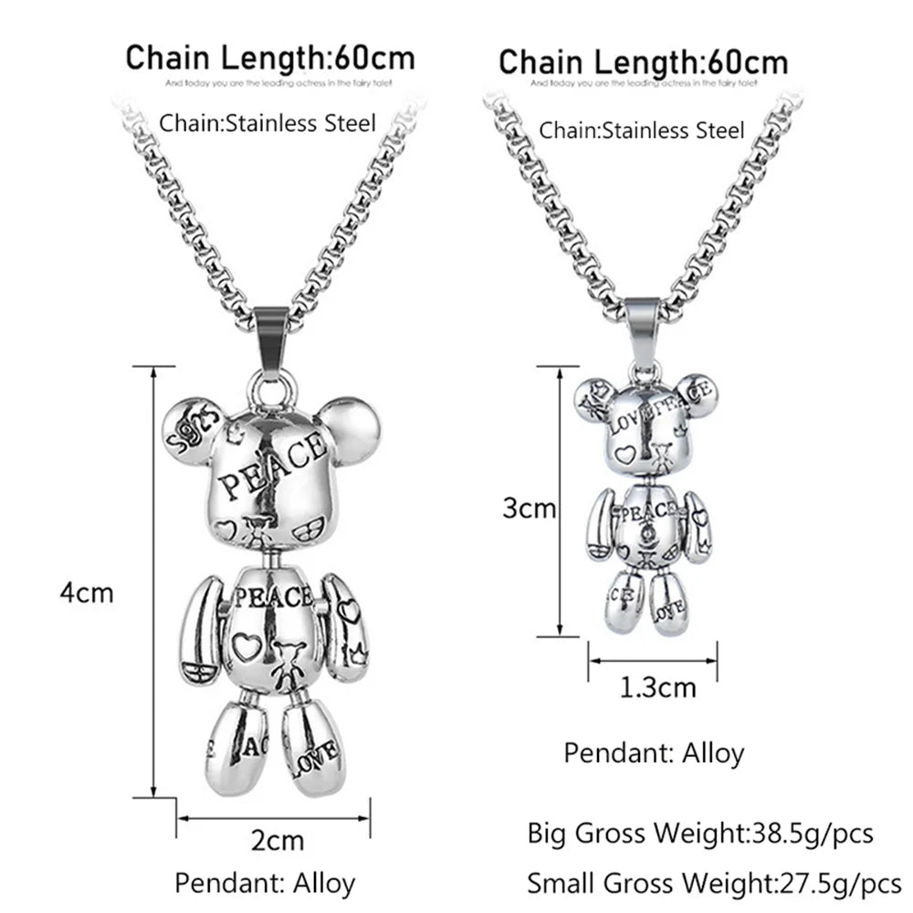 Silver stainless steel teddy bear pendant necklace with engraved text and symbols, shown in two sizes with chain length and pendant dimensions labeled on a white background.