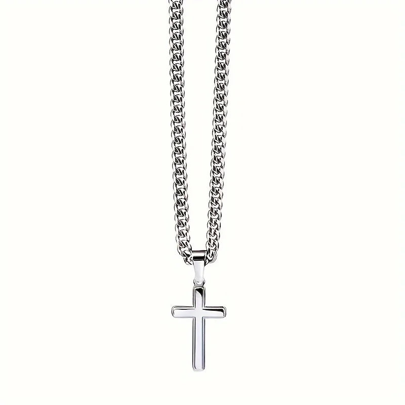 Silver cross necklace on a white background