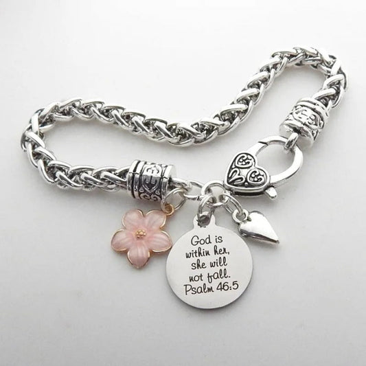 Silver bracelet with charms on a light gray background
