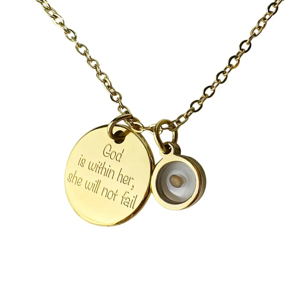 Gold necklace with two round pendants on a white background