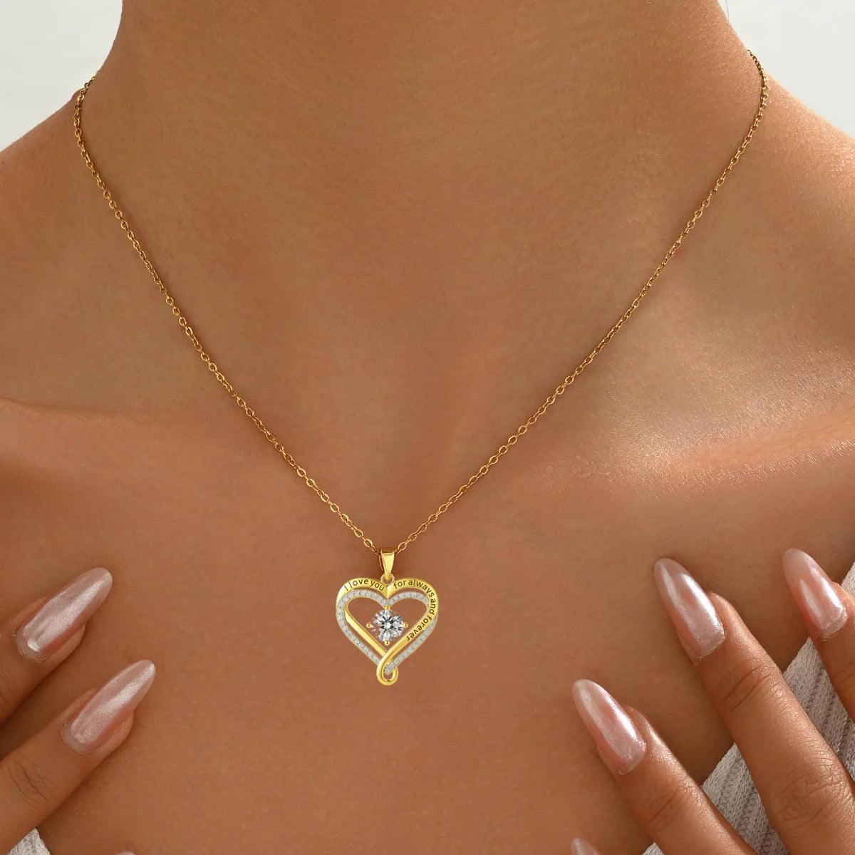 Gold necklace with a heart-shaped pendant on a person's neck