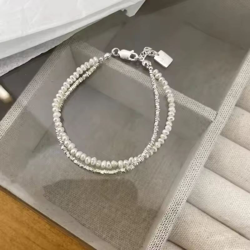 Pearl bracelet on a textured surface