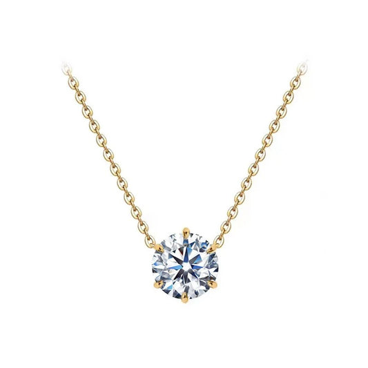 Gold necklace with a round diamond pendant on a white background