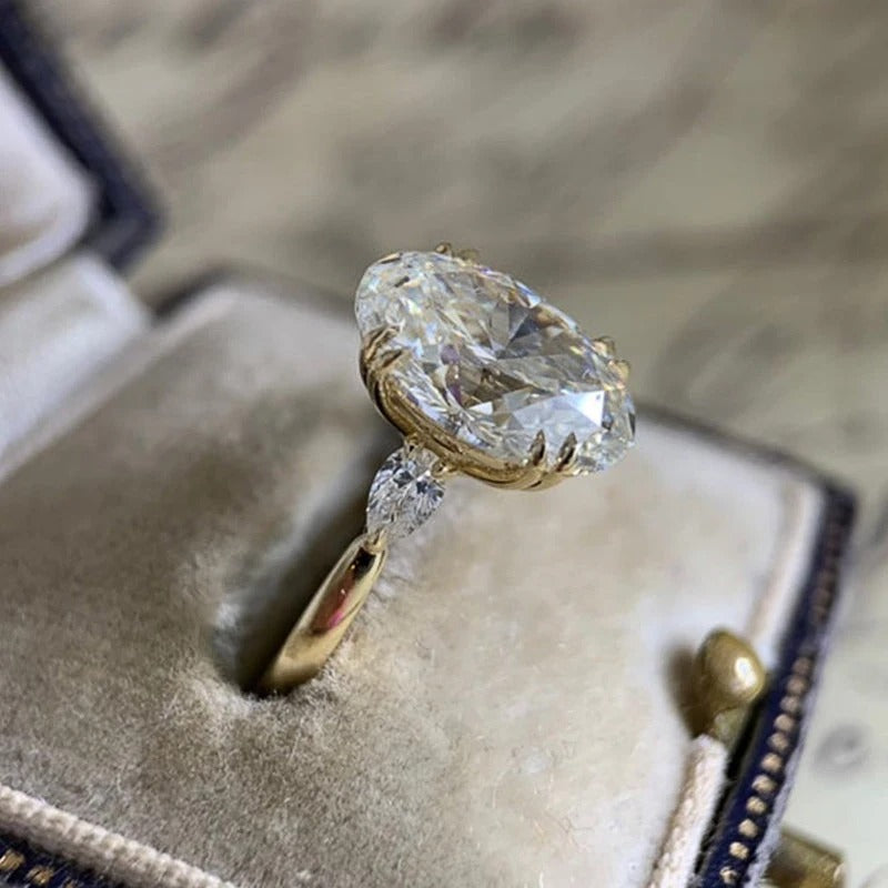 Silver ring with a large diamond on a textured surface