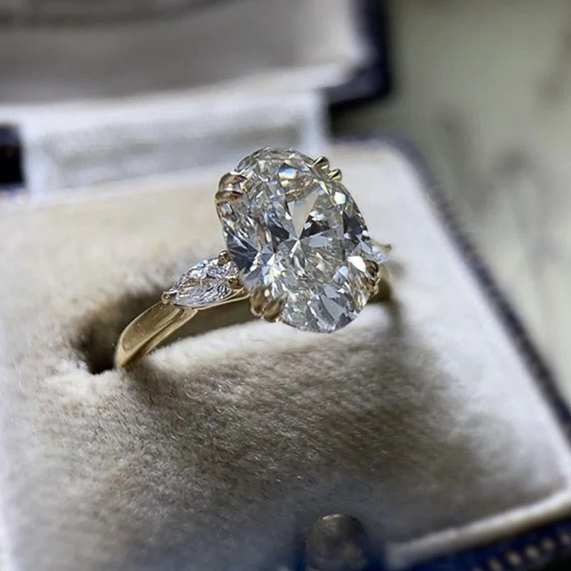 Gold ring with a large diamond in a jewelry box