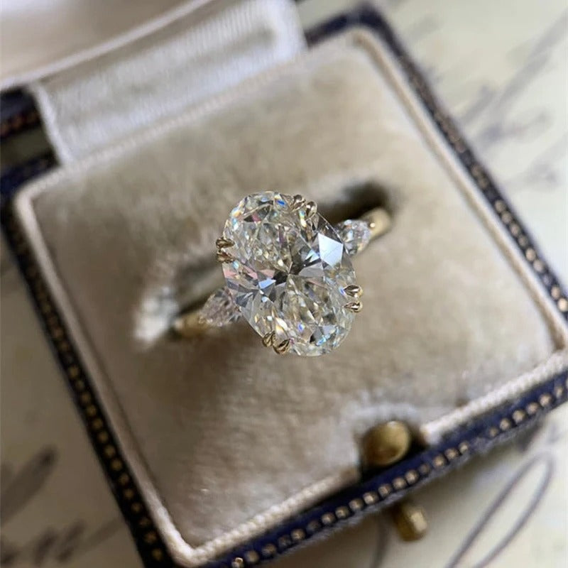 Diamond ring in an open jewelry box on a textured surface