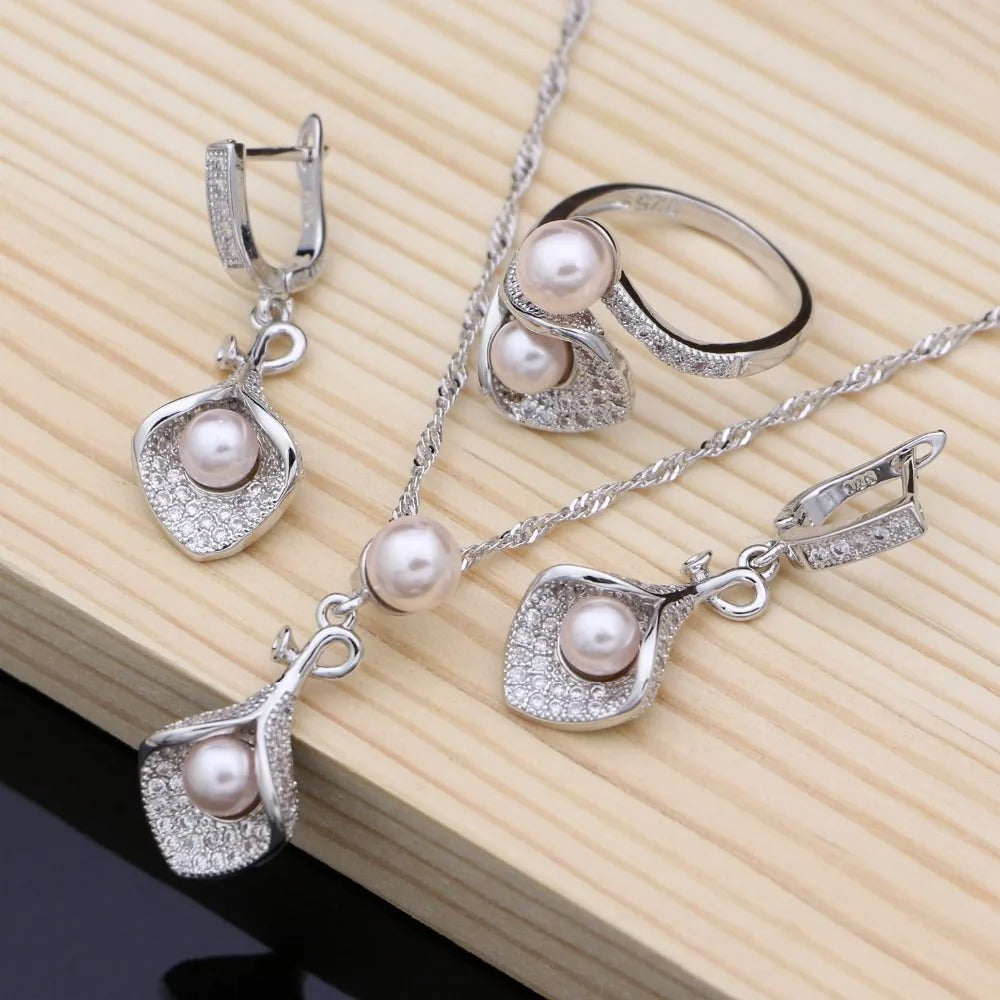 matching pearl jewelry set including necklace, earrings and ring