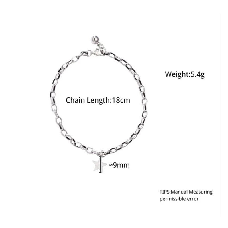 Silver chain bracelet with star charm on a white background