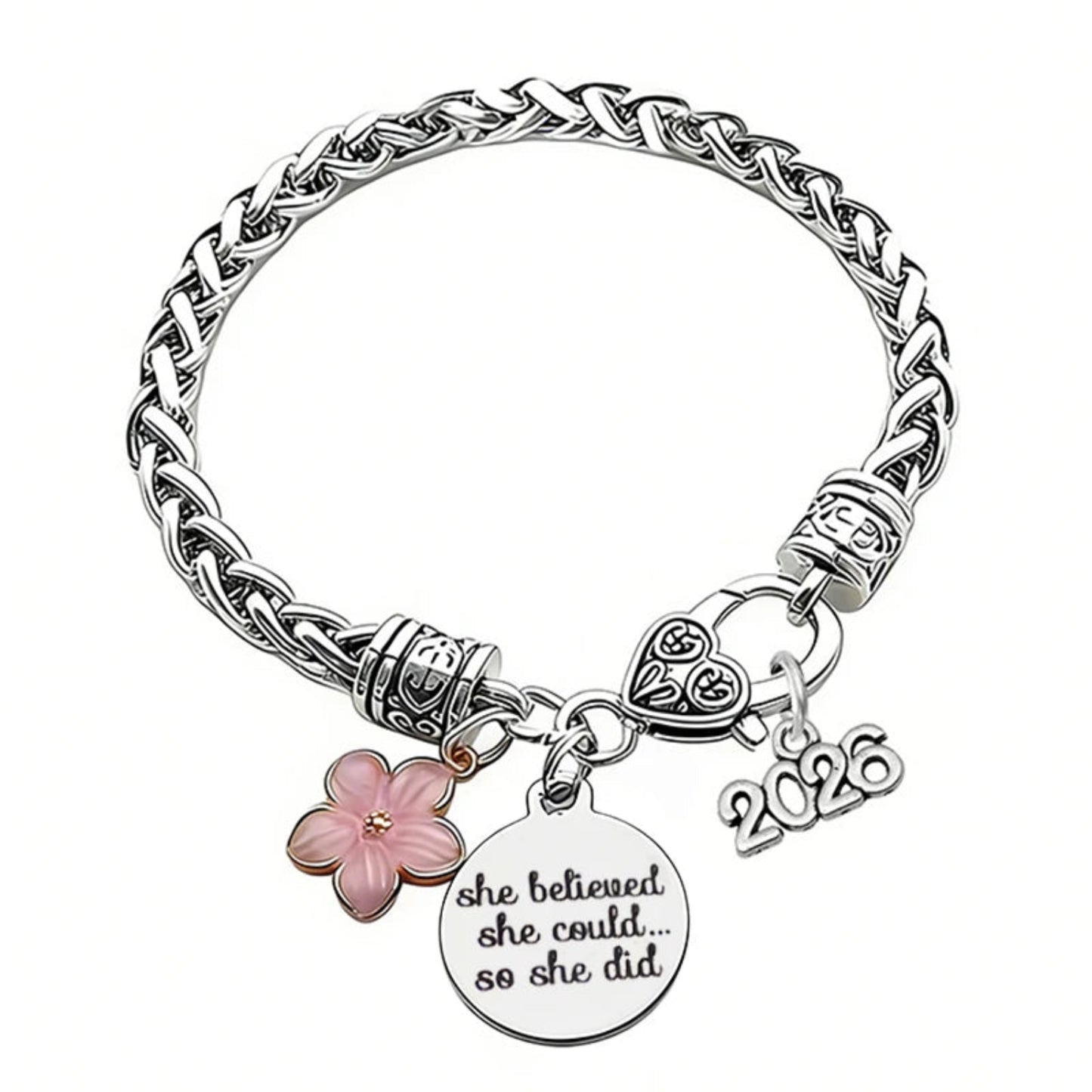 Silver bracelet with floral charm and 'she believed she could so she did' tag on a white background