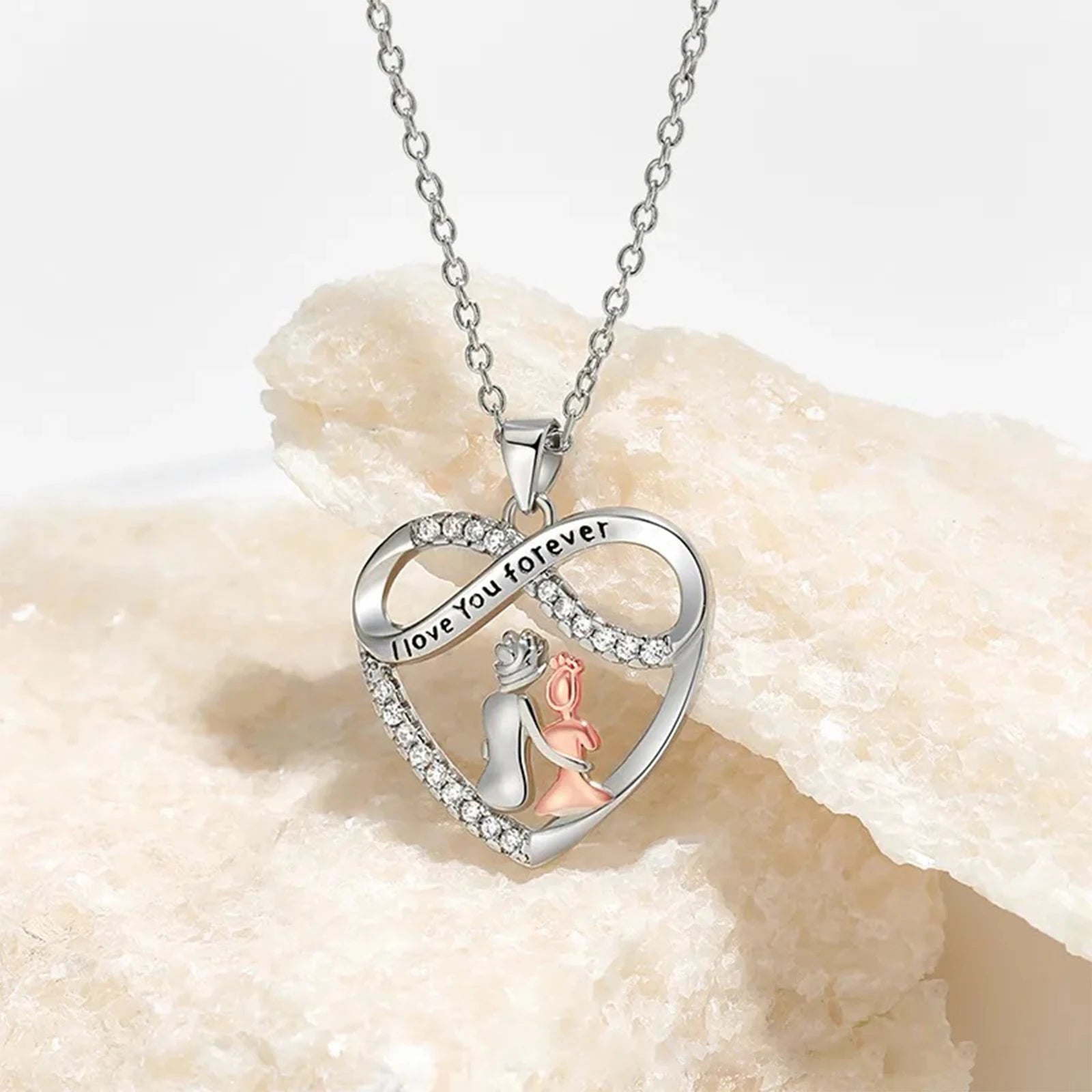 Silver necklace with heart-shaped pendant featuring a mermaid on a beige stone background