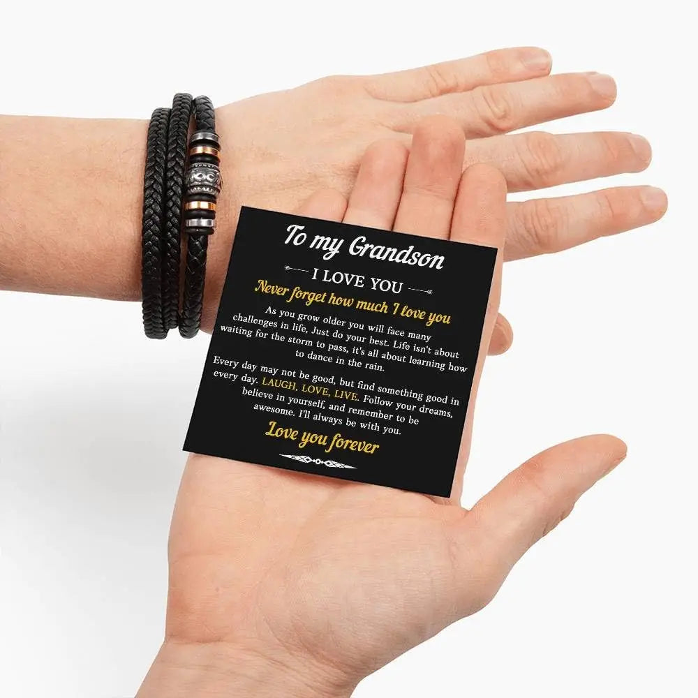 Hand holding a black card with white text on a white background