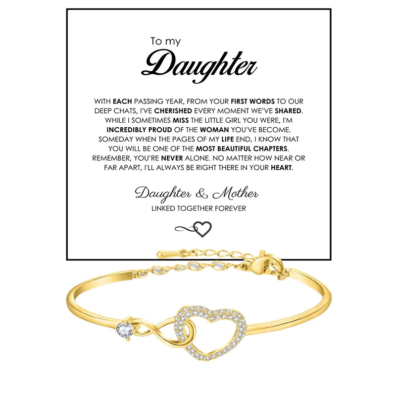 Gold bracelet with heart and infinity symbol on a white background with a message to a daughter.