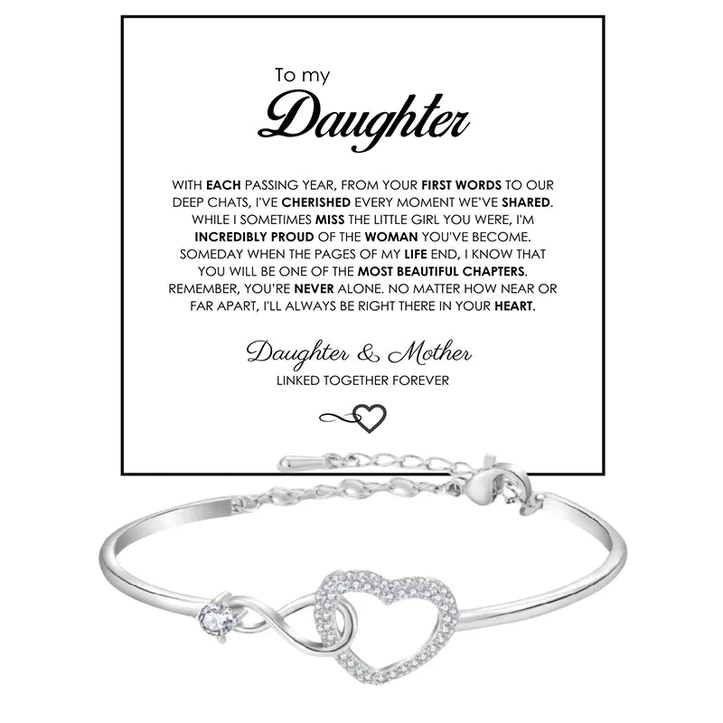 Silver bracelet with heart and infinity symbol on a white background with text.