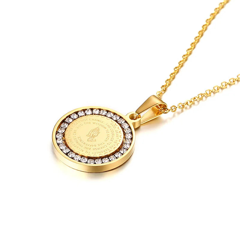 Gold necklace with a round pendant on a white background