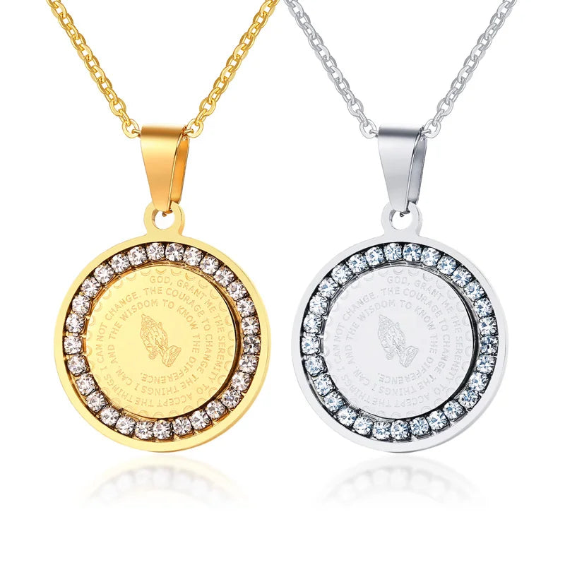 Gold and silver round pendants with engraved designs and diamond-like stones on a white background