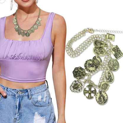 Purple top, denim shorts, and a necklace with religious charms on a white background