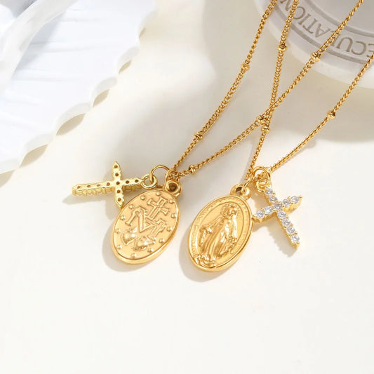 Two gold necklaces with various pendants on a white background