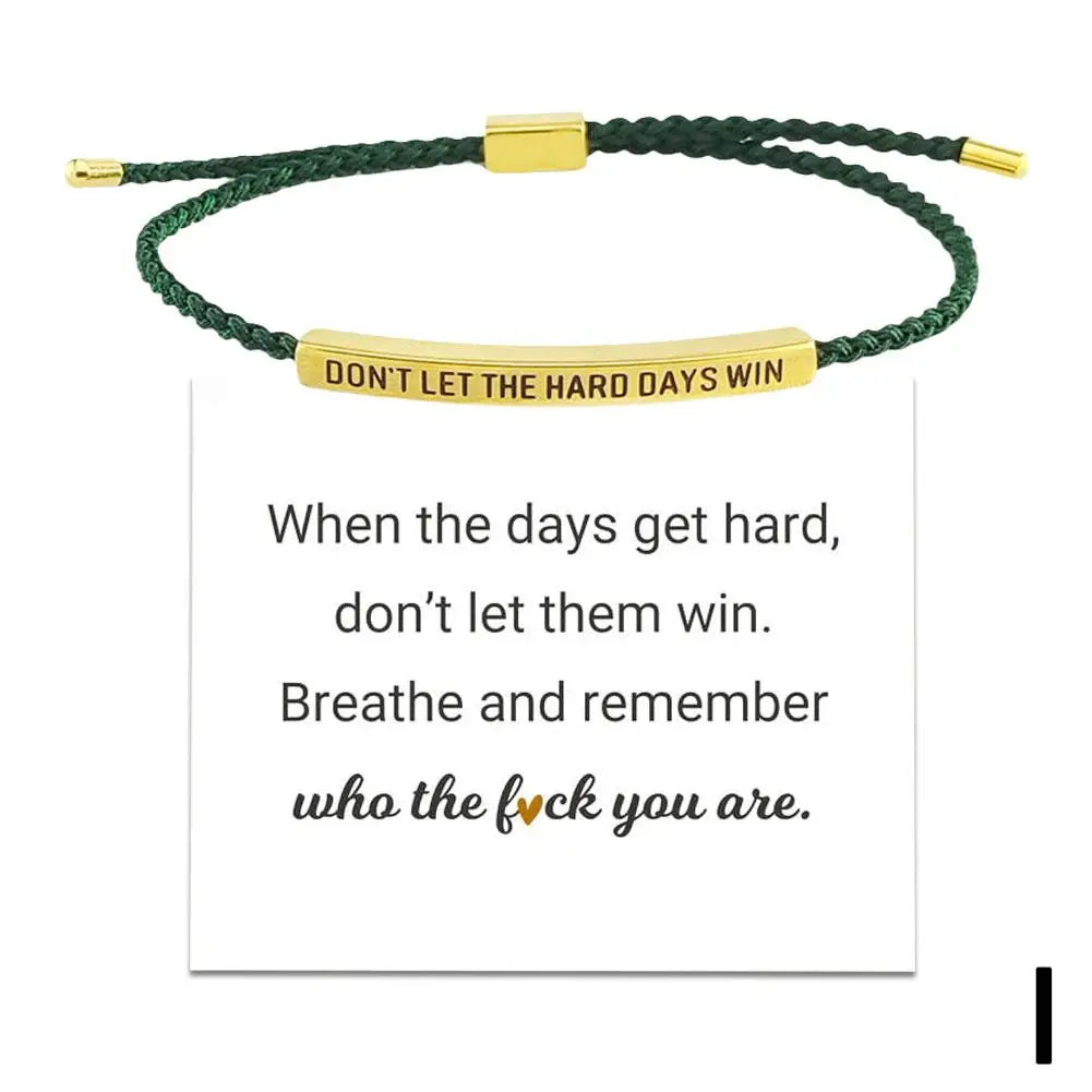 Green braided bracelet with gold bar and motivational quote on a white background