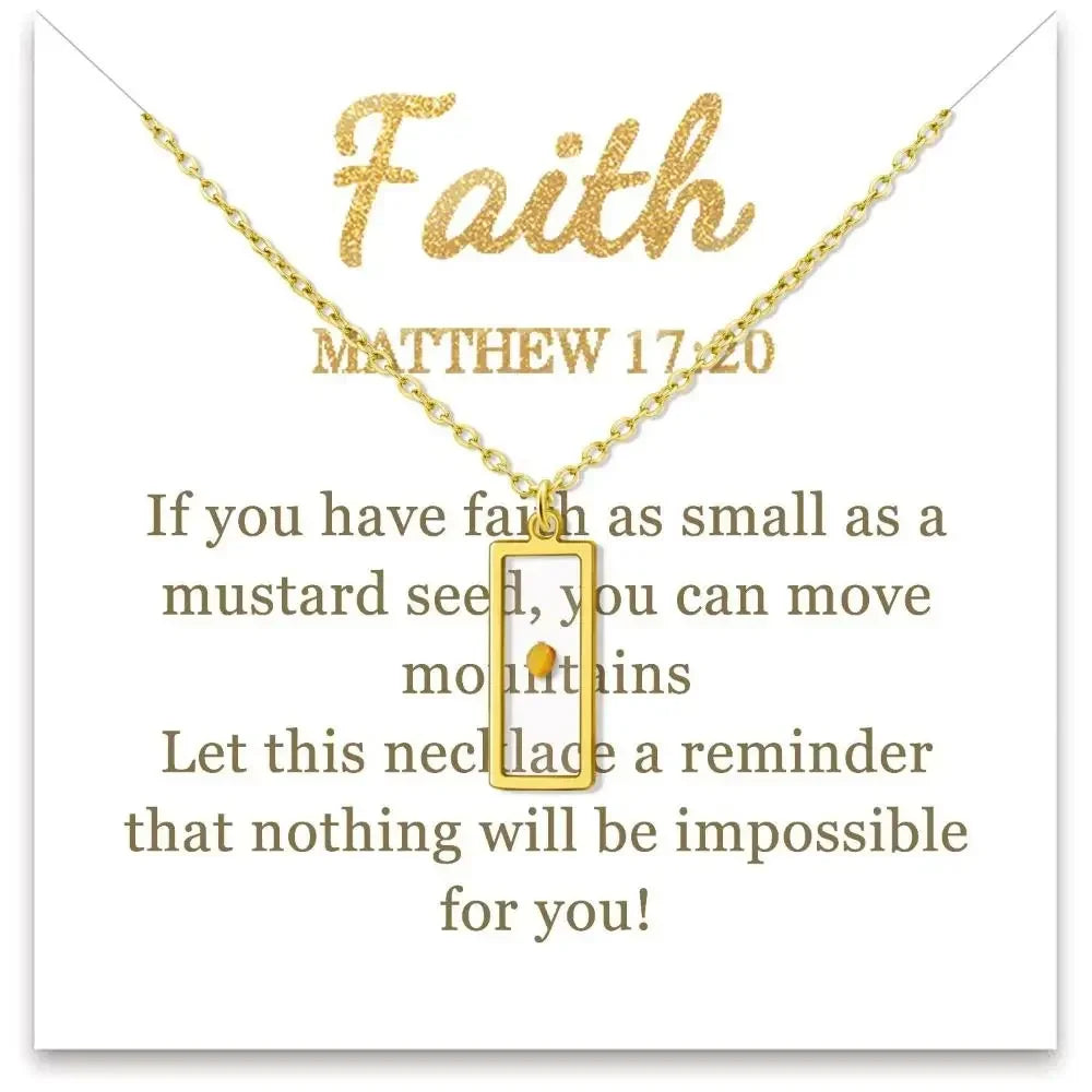 A gold necklace with a small rectangular pendant displayed on a white card. The card features the word 'Faith' in glittery gold, the Bible verse Matthew 17:20, and inspirational text in brown lettering.