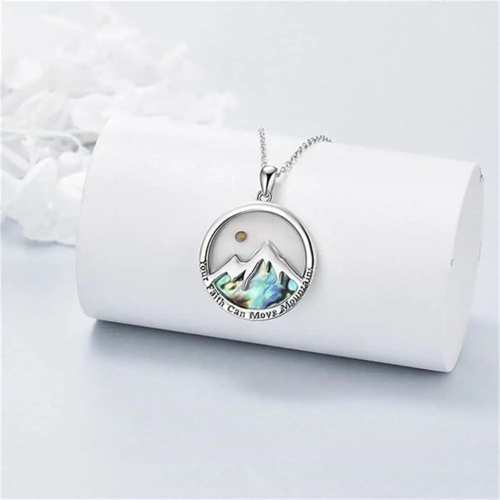 Necklace with a mountain pendant on a white background