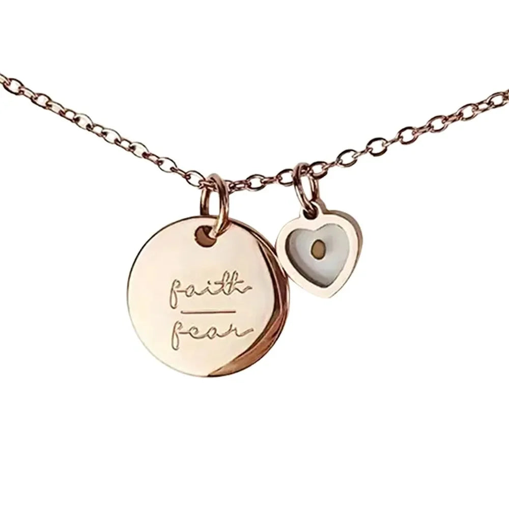 Rose gold necklace with 'faith' pendant on a white background