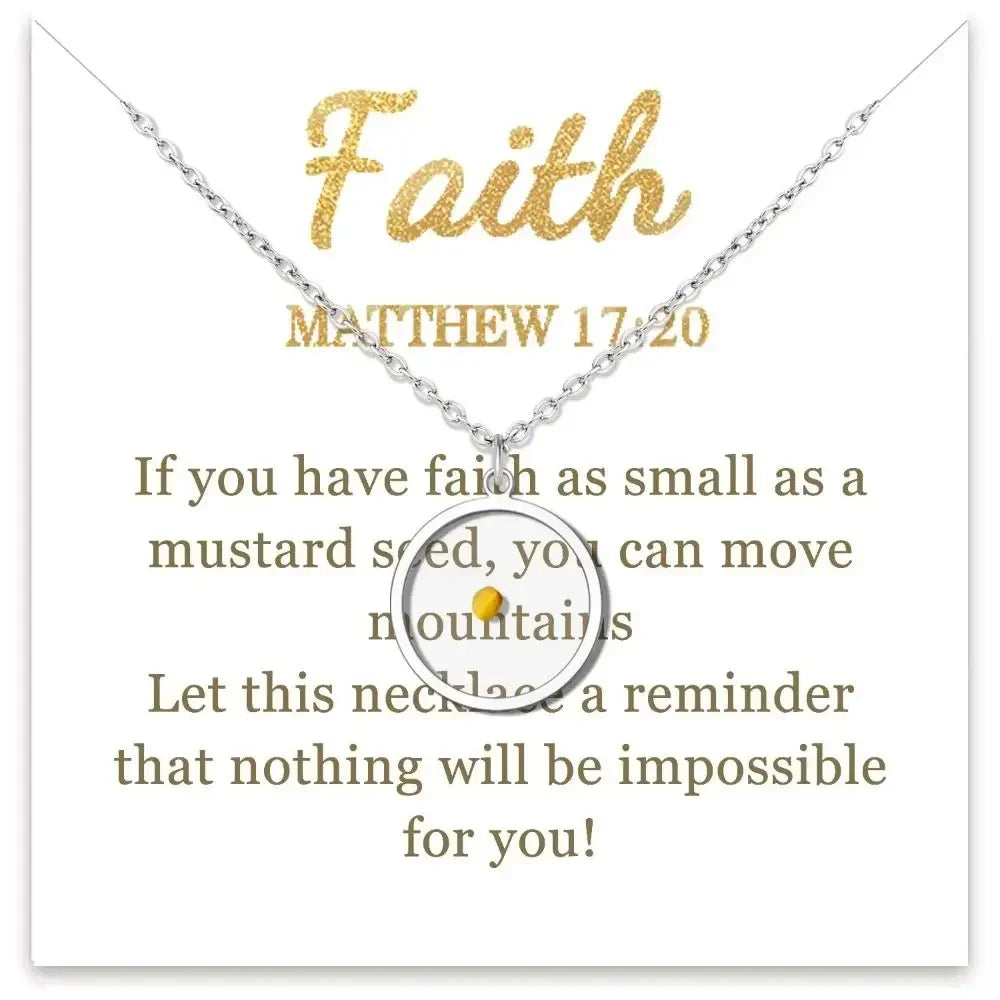 A silver necklace with a circular pendant featuring a small gold dot, displayed on a white card with gold text reading 'Faith' and 'MATTHEW 17:20' plus a message about mustard seed faith.