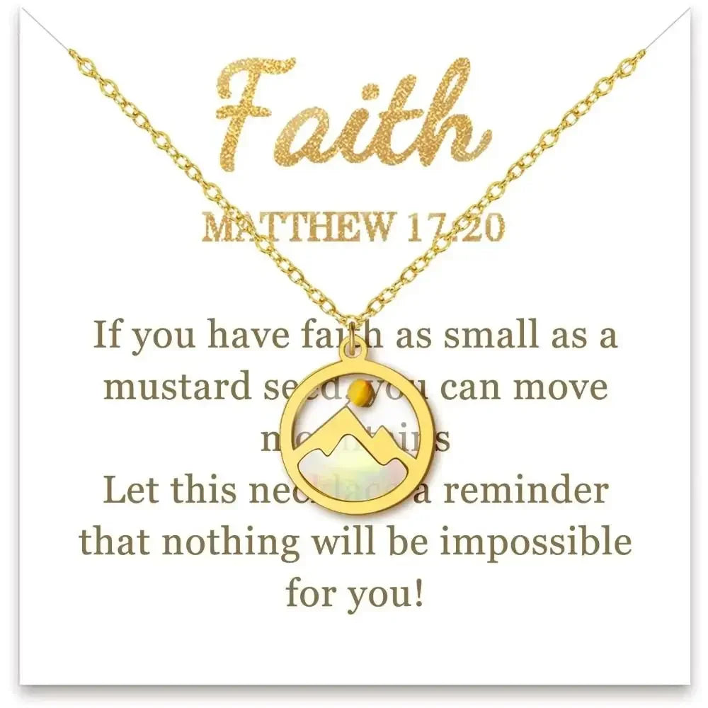 Gold necklace with a mountain-shaped pendant displayed on a white card that reads 'Faith' and Matthew 17:20 with inspirational text.