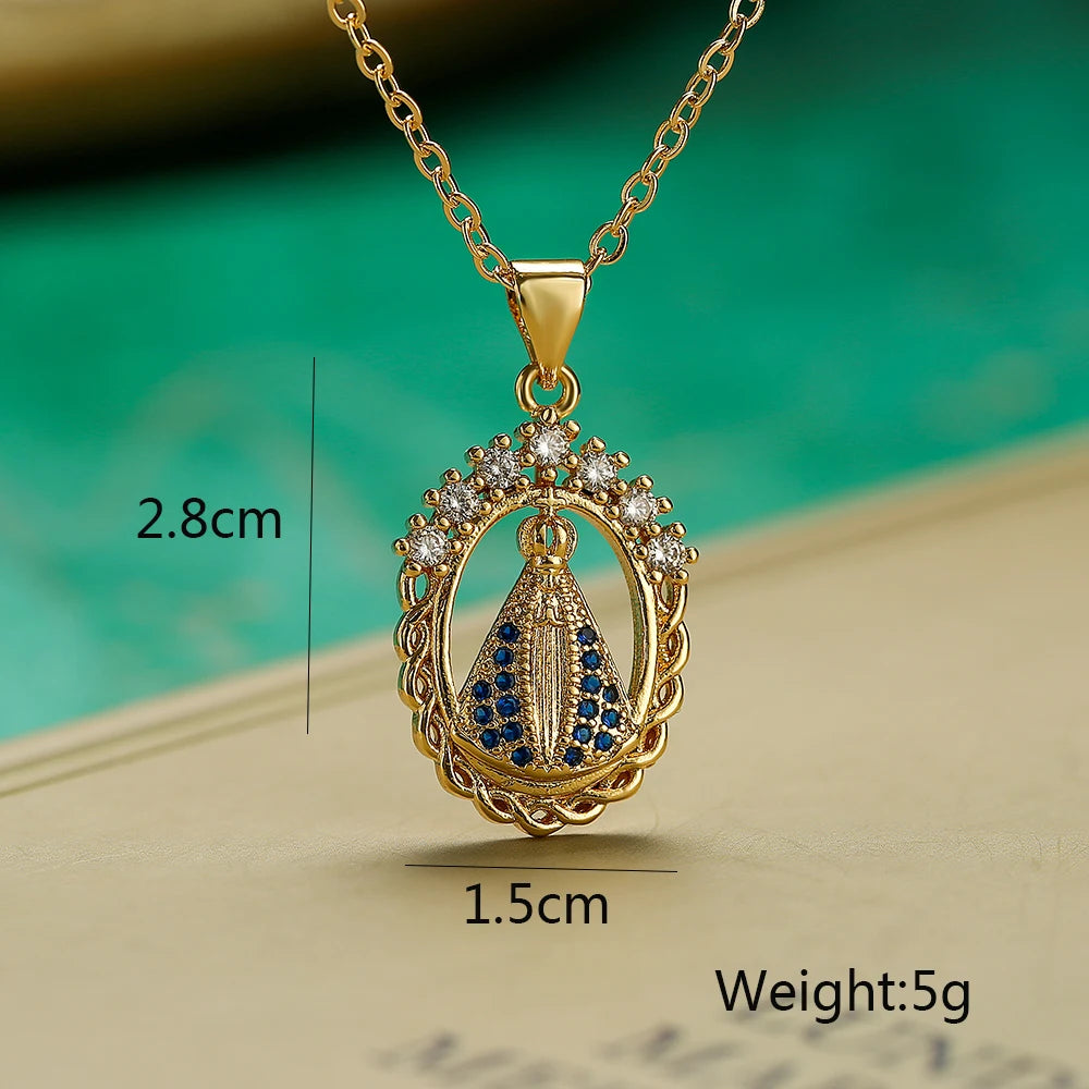 Gold necklace with pendant on a textured surface and blurred green background