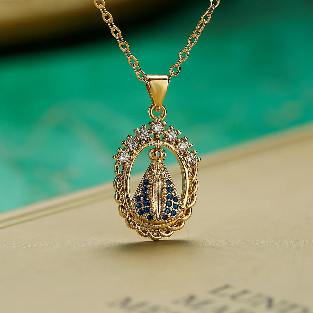 Gold necklace with a pendant featuring blue stones and diamonds on a textured surface.