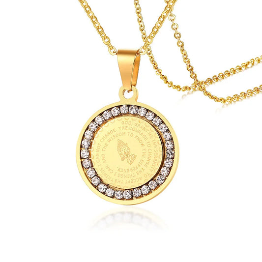 Gold necklace with a round pendant featuring engraved text and diamond accents on a white background