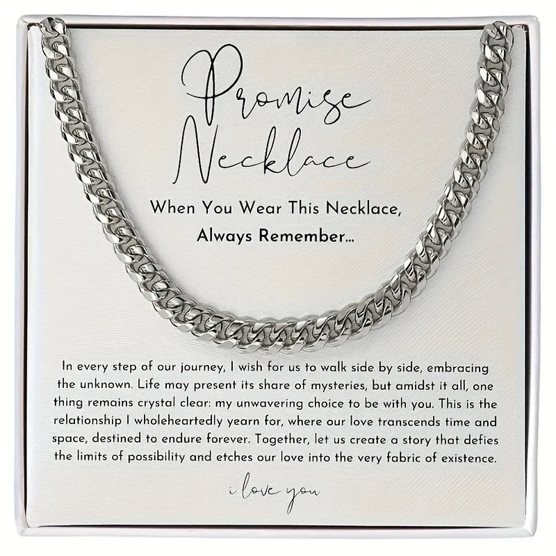 Silver chain necklace on a white card with text