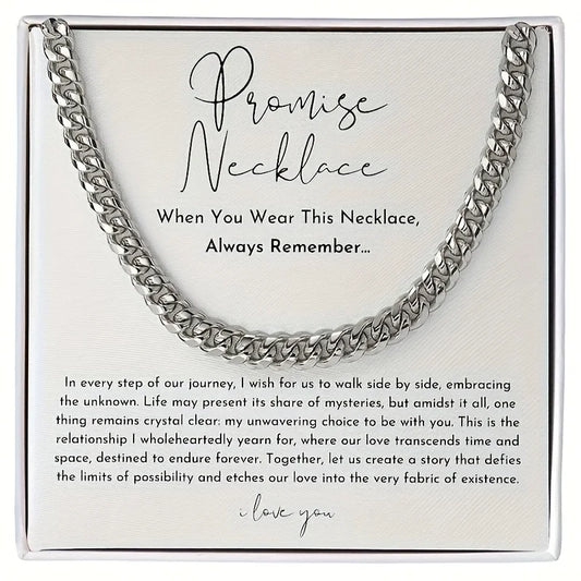 Silver chain necklace on a white card with text