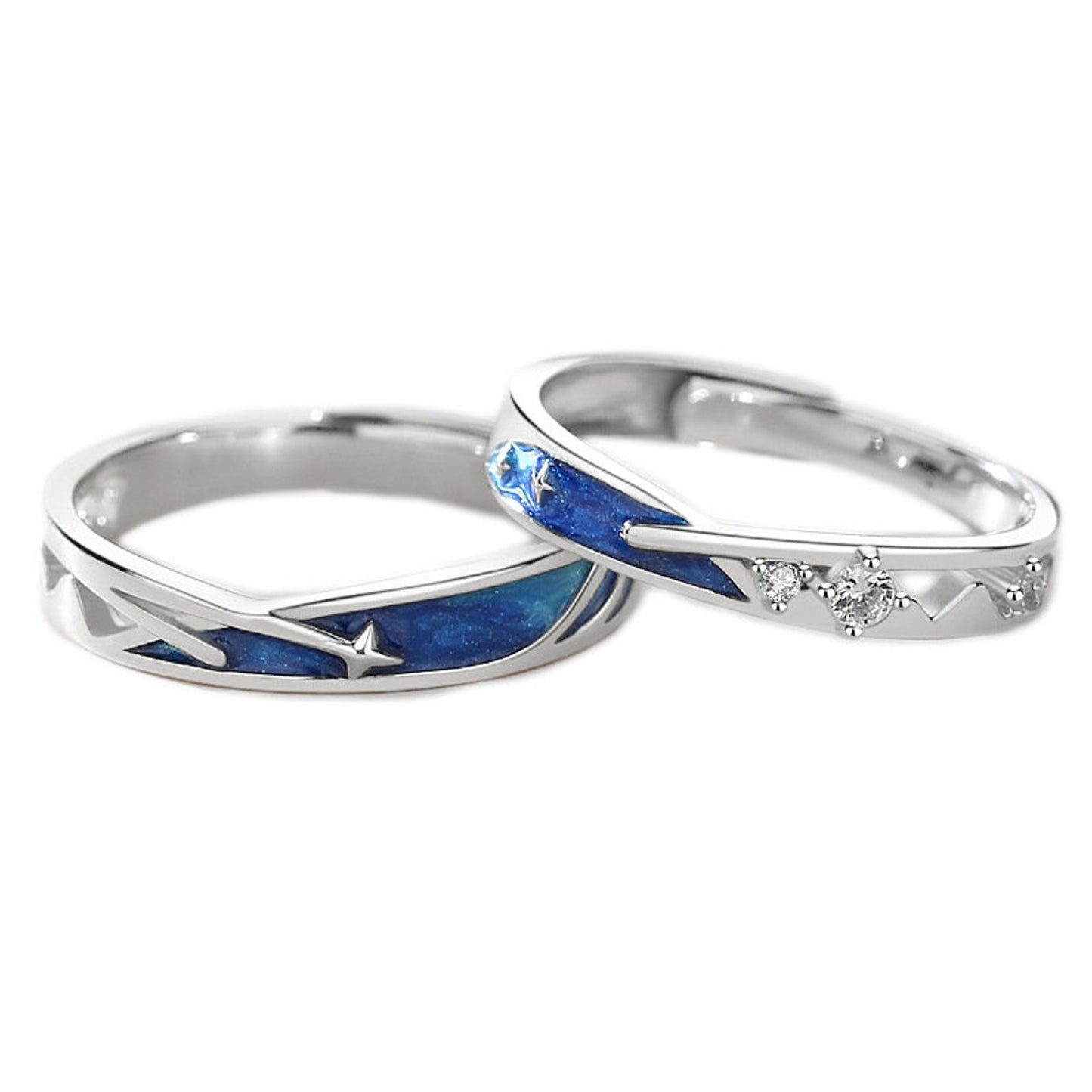 Two silver rings with blue inlay and diamond accents on a white background