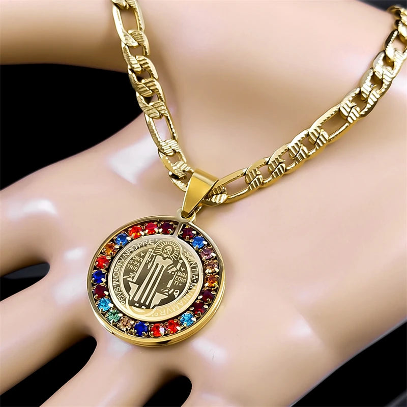 Gold necklace with a colorful pendant on a mannequin hand