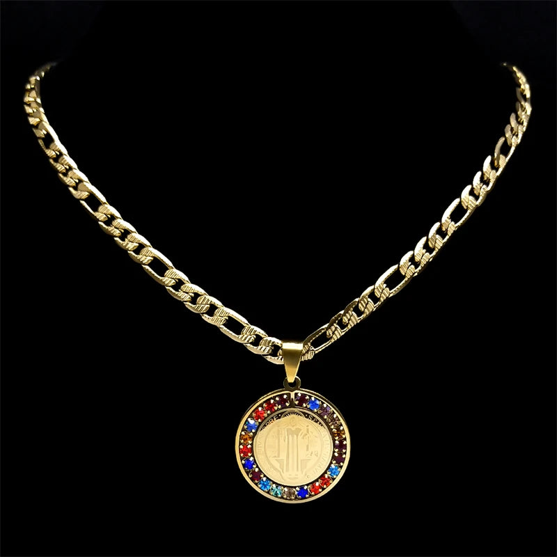 Gold necklace with a round pendant featuring colorful stones on a black background