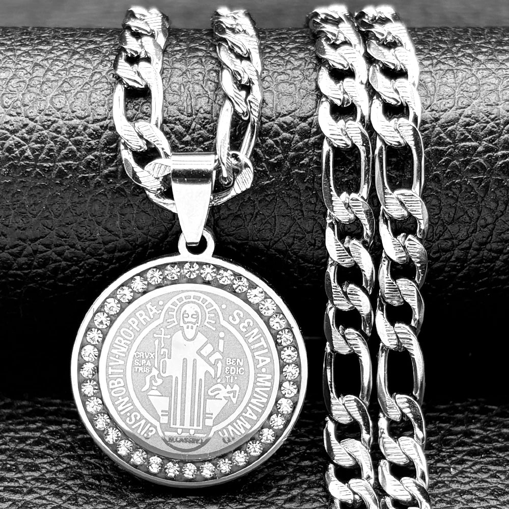 Silver pendant with chain on a textured surface