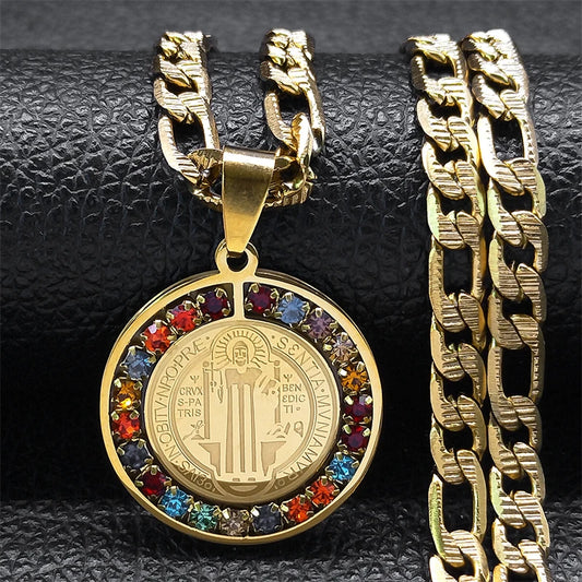 Gold necklace with a colorful pendant on a textured black background